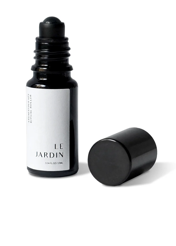 Black and white bottle of 'Le Jardin' on a white background