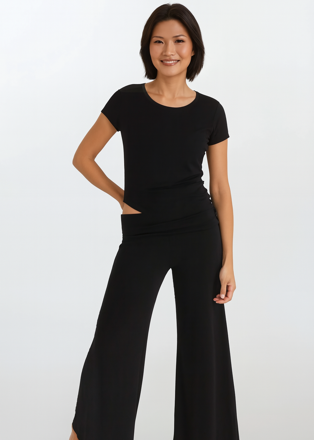 Woman wearing a black outfit on a white background